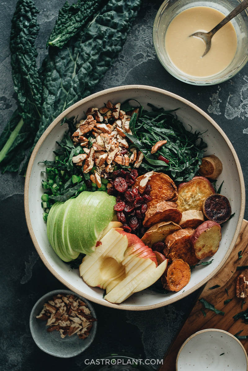 Vegan kale salad ingredients in bowl