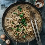 Creamy and healthy vegan mushroom pasta in a skillet