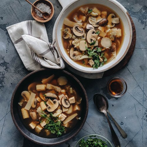 Bowls of steaming vegan hot and sour soup for dinner