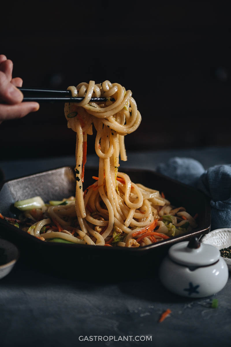 Serving easy plant-based stir-fried udon noodles for dinner