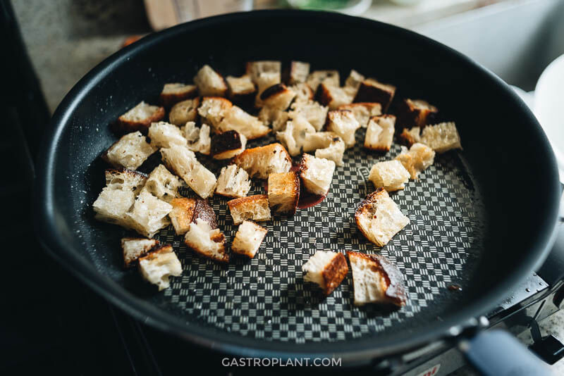 Toasting croutons in a skillet