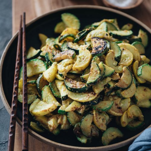 Easy 3-ingredient sauteed summer squash on a plate with chopsticks