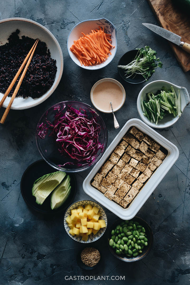 Prepared vegan poke bowl ingredients on the table