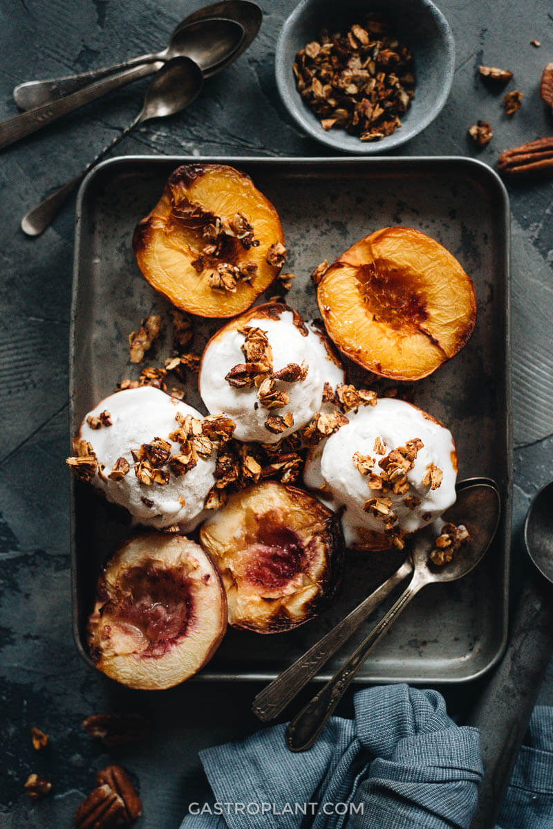 Roasted peaches and vanilla vegan ice cream topped with homemade granola
