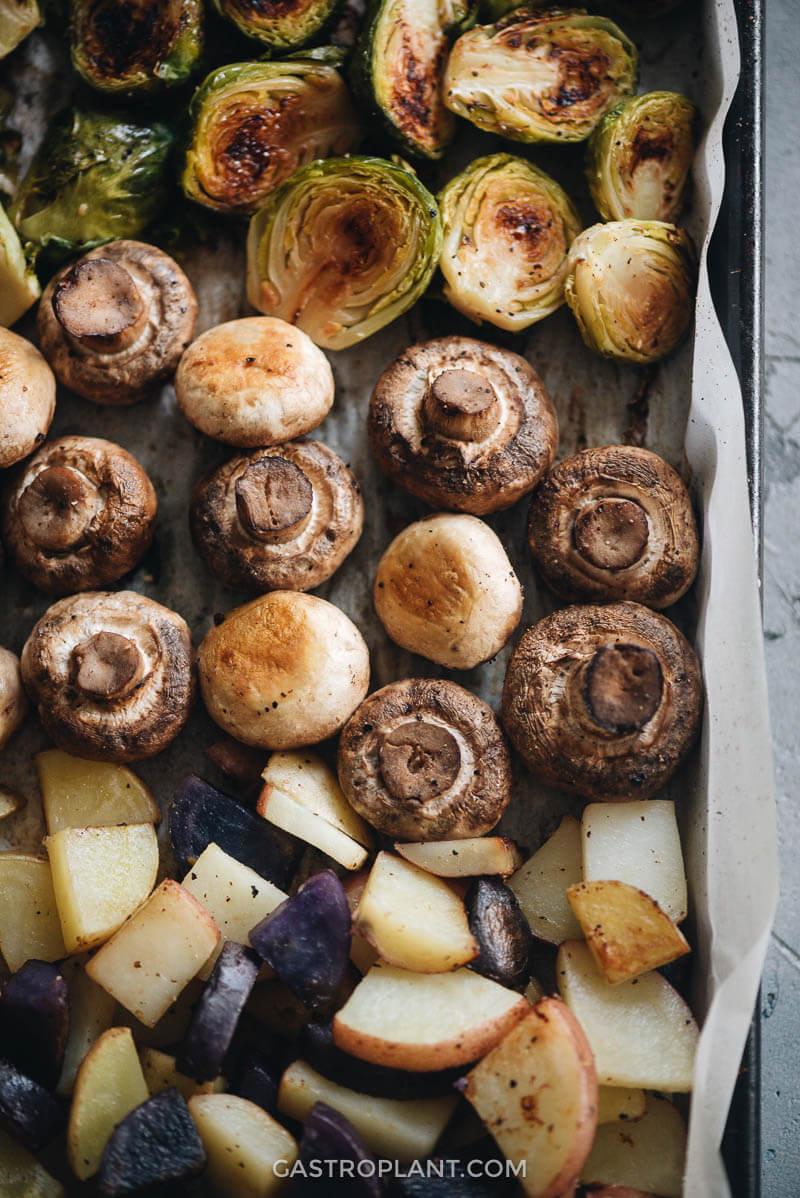 Close-up of roasted mushrooms, brussels sprouts, and potatoes