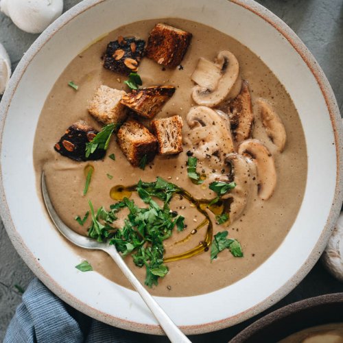 Vegan cream of mushroom soup in a white bowl