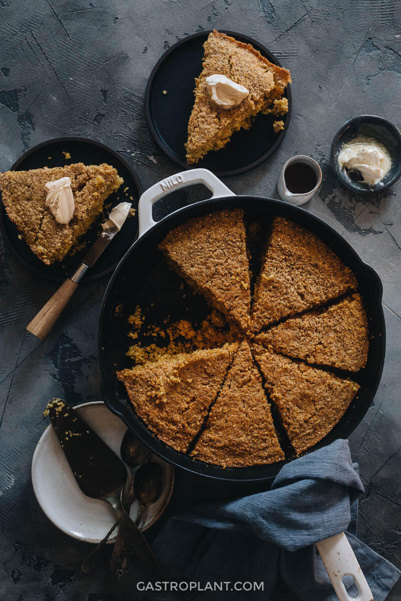Vegan cornbread in a skillet with butter