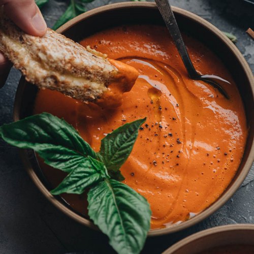 Super easy 4-ingredient vegan tomato soup with basil dipping grilled cheese sandwich in it