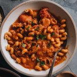 Square image of vegan pasta e fagioli soup