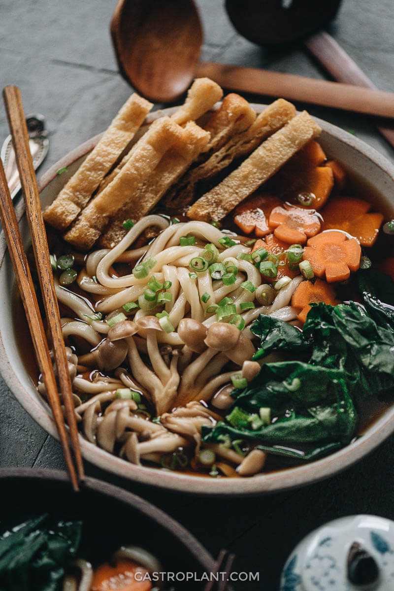 Vegan udon noodle soup with homemade broth and crispy tofu