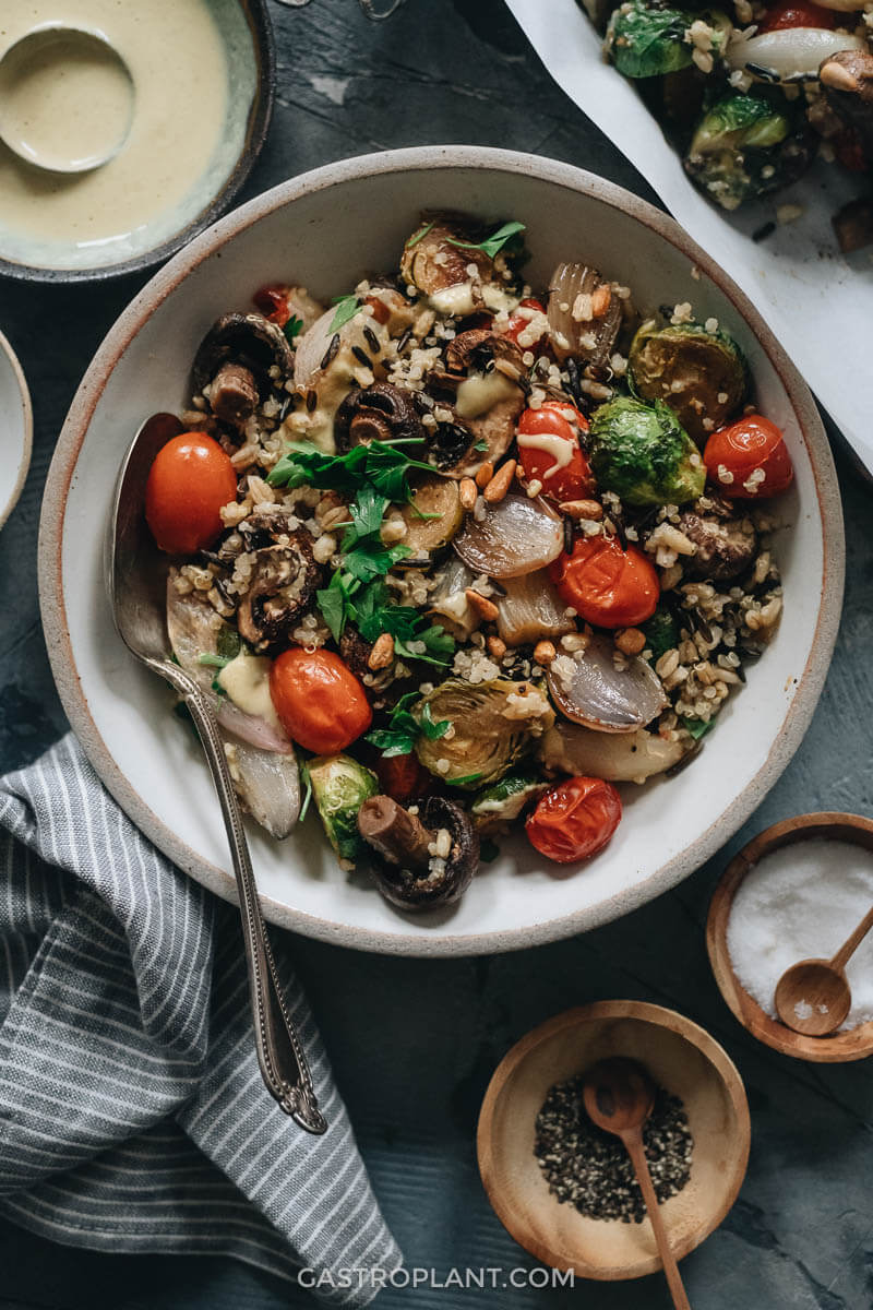 Roasted vegetable salad with tomatoes, brussels sprouts, mushrooms, and mixed grains with homemade dressing