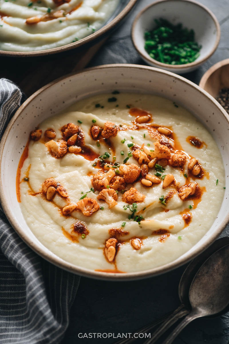 Creamy vegan cauliflower soup with pine nuts