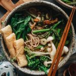 Soba buckwheat noodles in vegan tsuyu broth with green spring vegetables