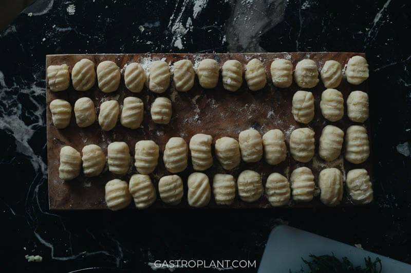 A tray of uncooked potato gnocchi ready to be cooked