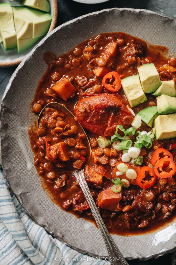 Close-up photo of vegan lentil chili with sweet potatoes