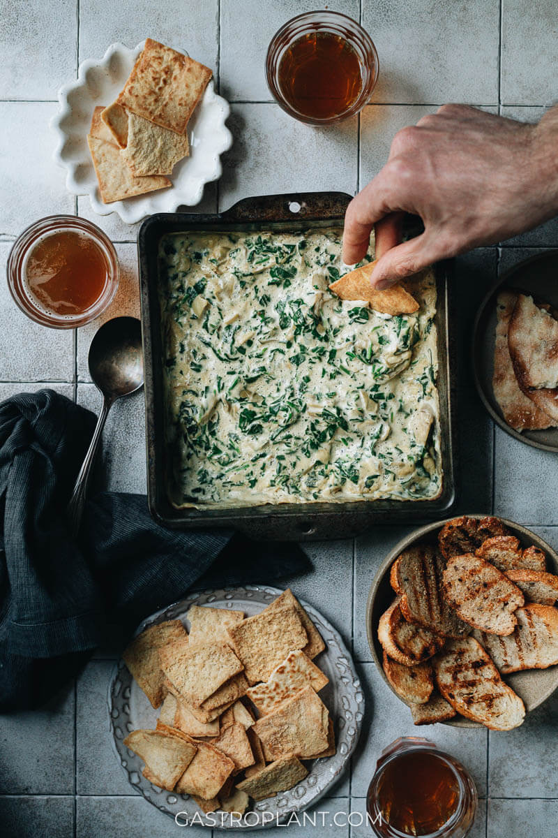 Vegan spinach artichoke dip served as a party appetizer