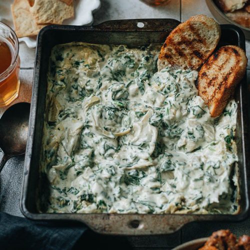 Extra creamy spinach artichoke dip with grilled toast