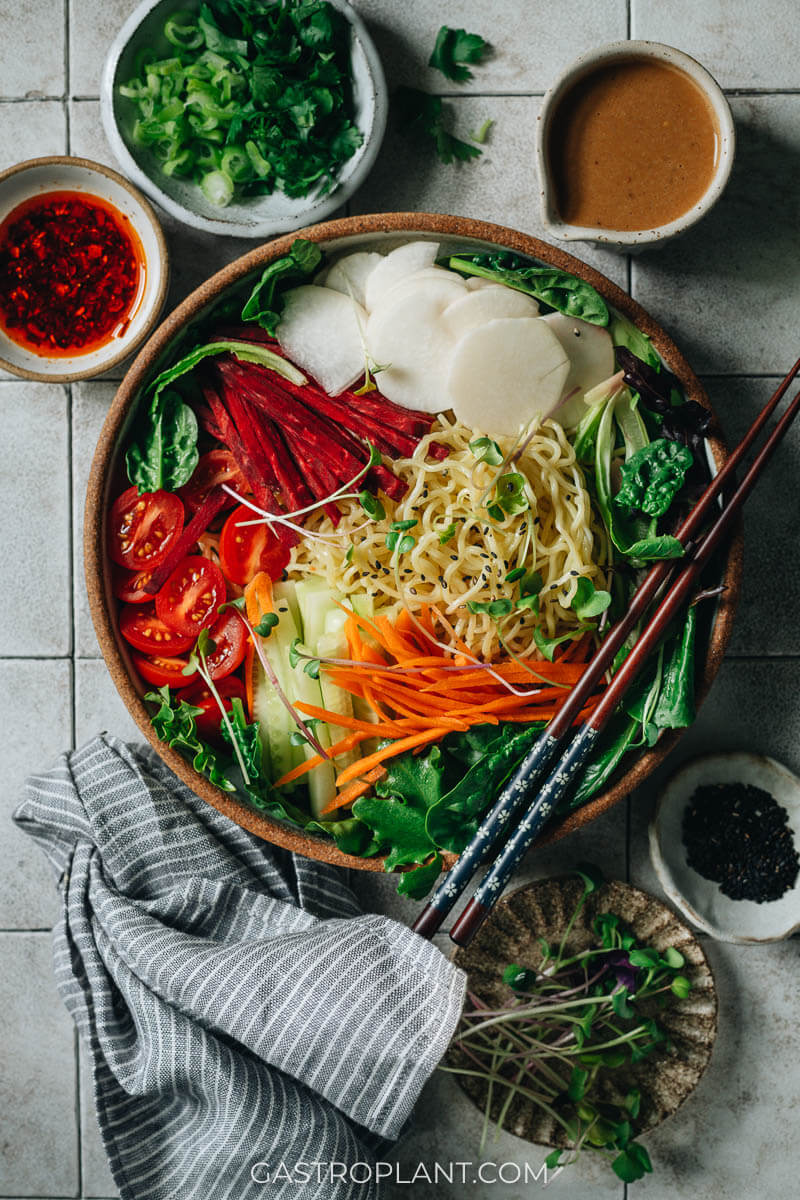 A colorful bowl of easy cold sesame noodles with mixed fresh veggies