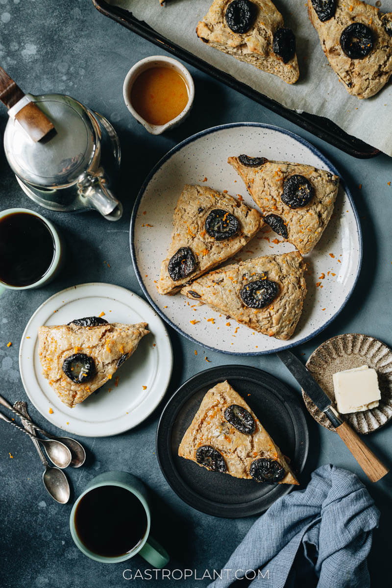 Orange and prune scones made from all vegan ingredients, spiced with cinnamon and nutmeg and served with coffee