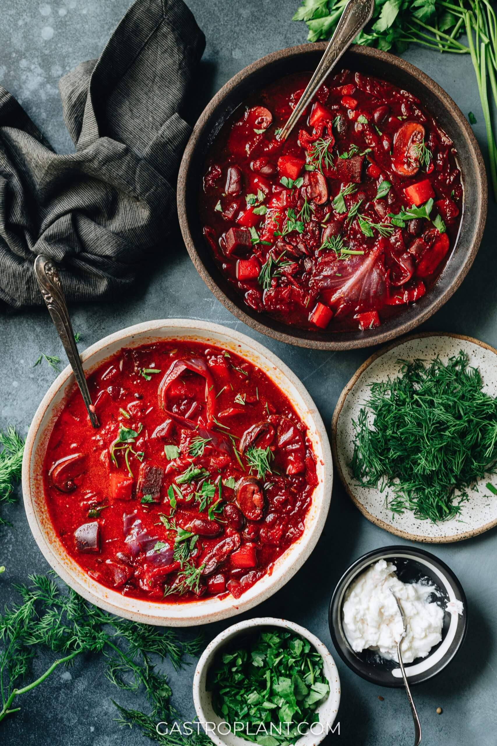 Two bowls of bright red bold vegan borscht