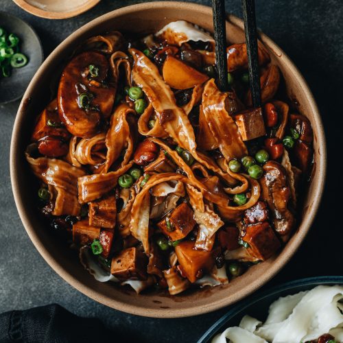 Korean jajangmyeon noodles with fermented black bean sauce and thick fresh noodles with veggies, mushrooms, tofu, and potato