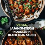 Two bowls of plant-based vegan jajangmyeon (Korean noodles with dark black bean sauce and colorful vegetables)